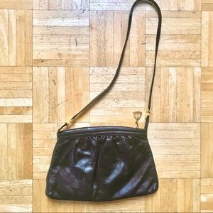 Vintage Brown Leather handbag with strap.